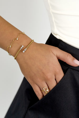 Symmetrisch gepunktetes Armband mit detaillierten Enden