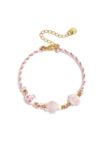 Armband mit Schildpatt- und Muschelperlen und Seilmotiv